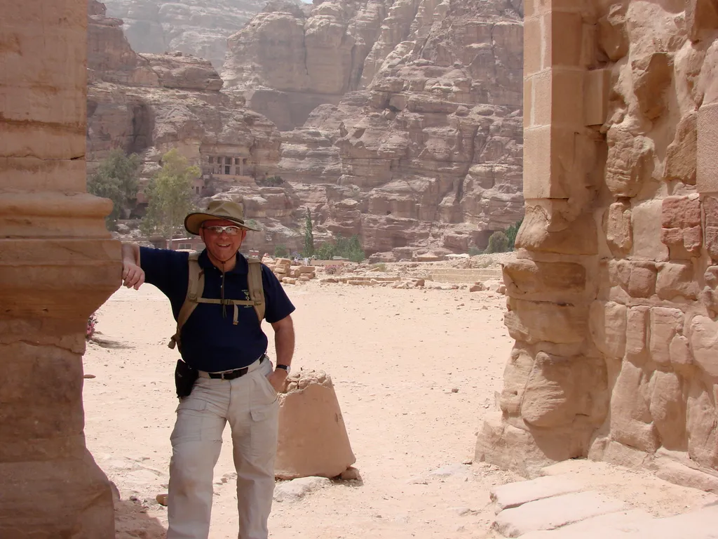 Dr. House in front of some of the tombs at Petra (in the background)