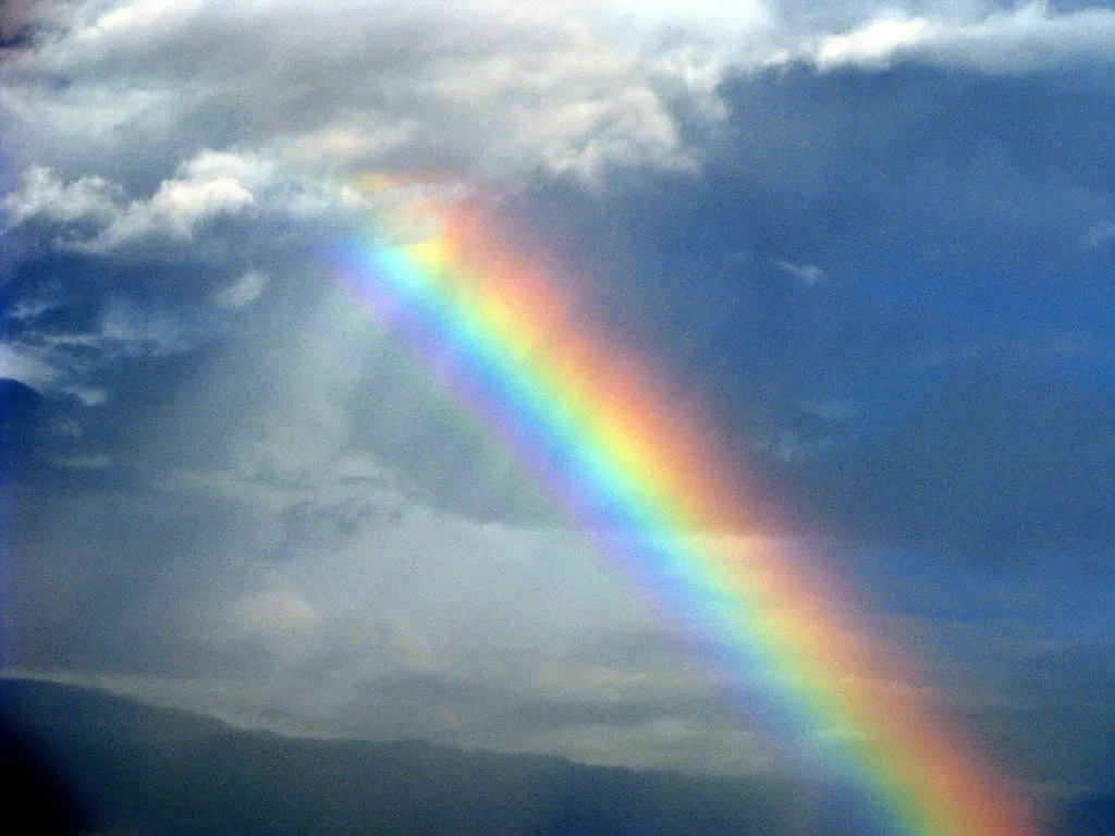 Enhanced Rainbow in the Midst of Rain Clouds Reveals the Character of God
