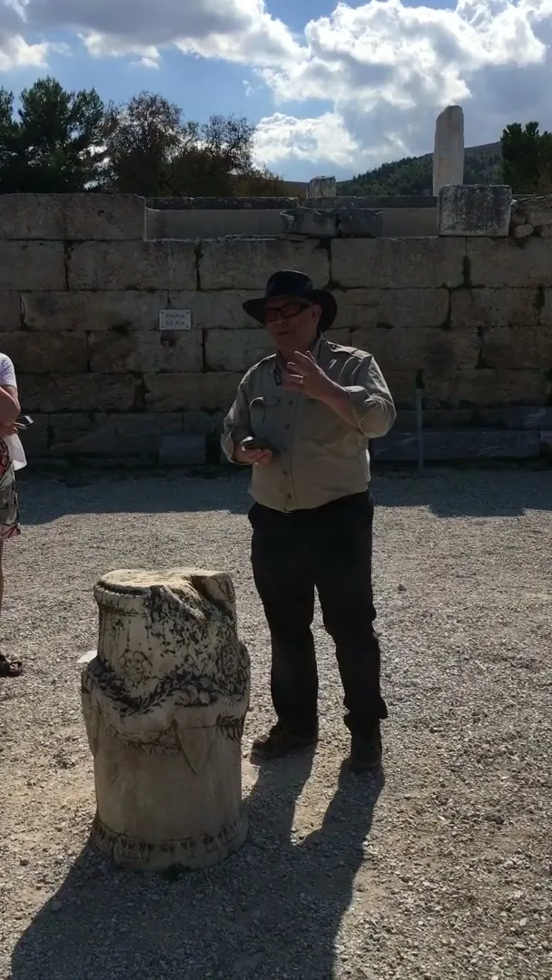 Dr. House speaking in front of the Bema in Corinth (Acts 18:12)